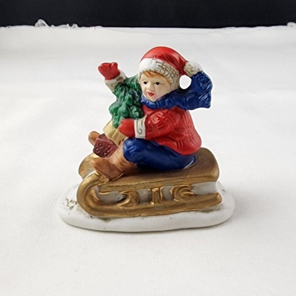 Vintage Russ Berrie & Co. Waving Child on Sleigh with Tree Item No 9734